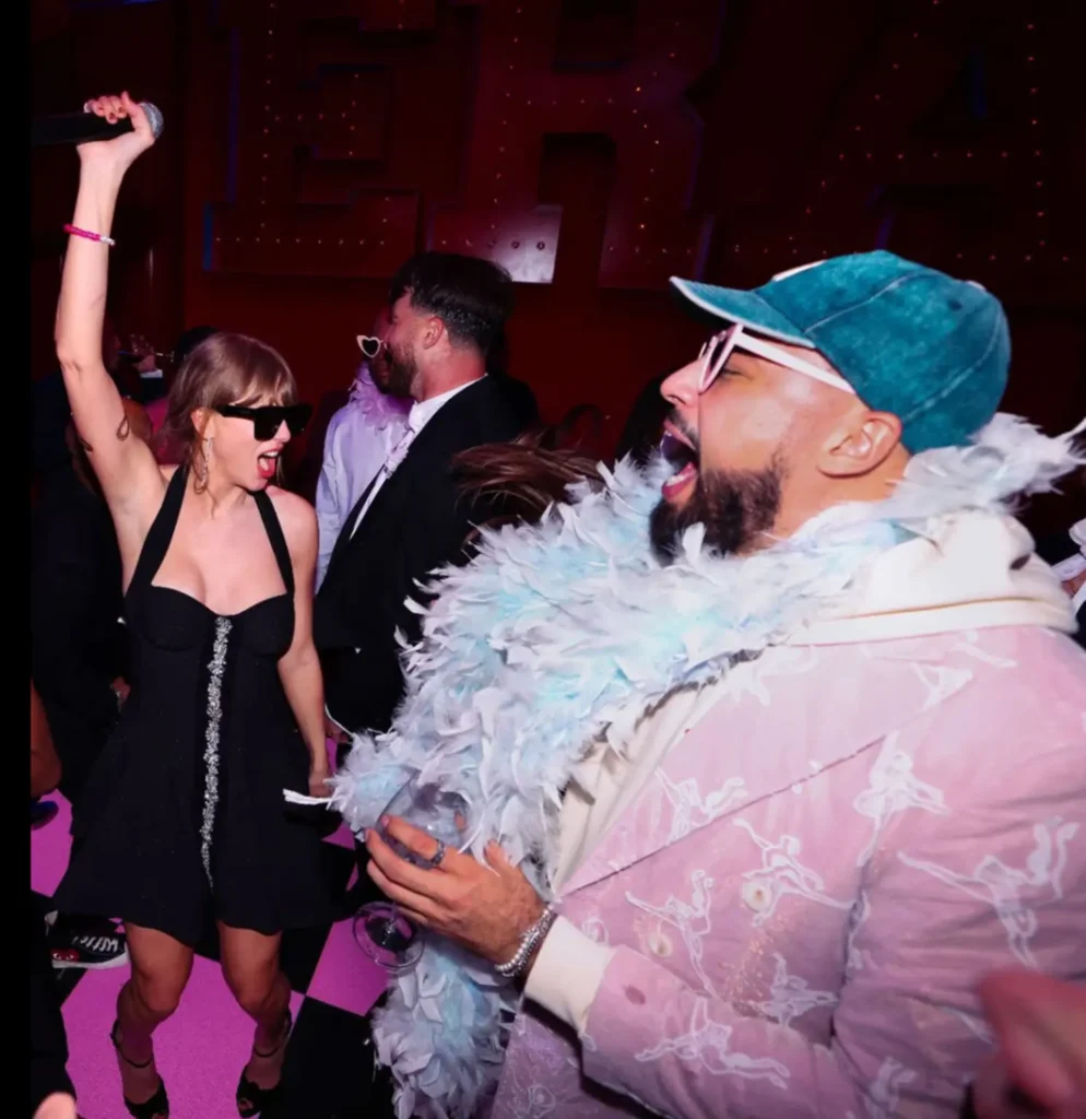 Taylor Swift dancing with Travis Kelce at the Eras Tour wrap party in Kansas City.